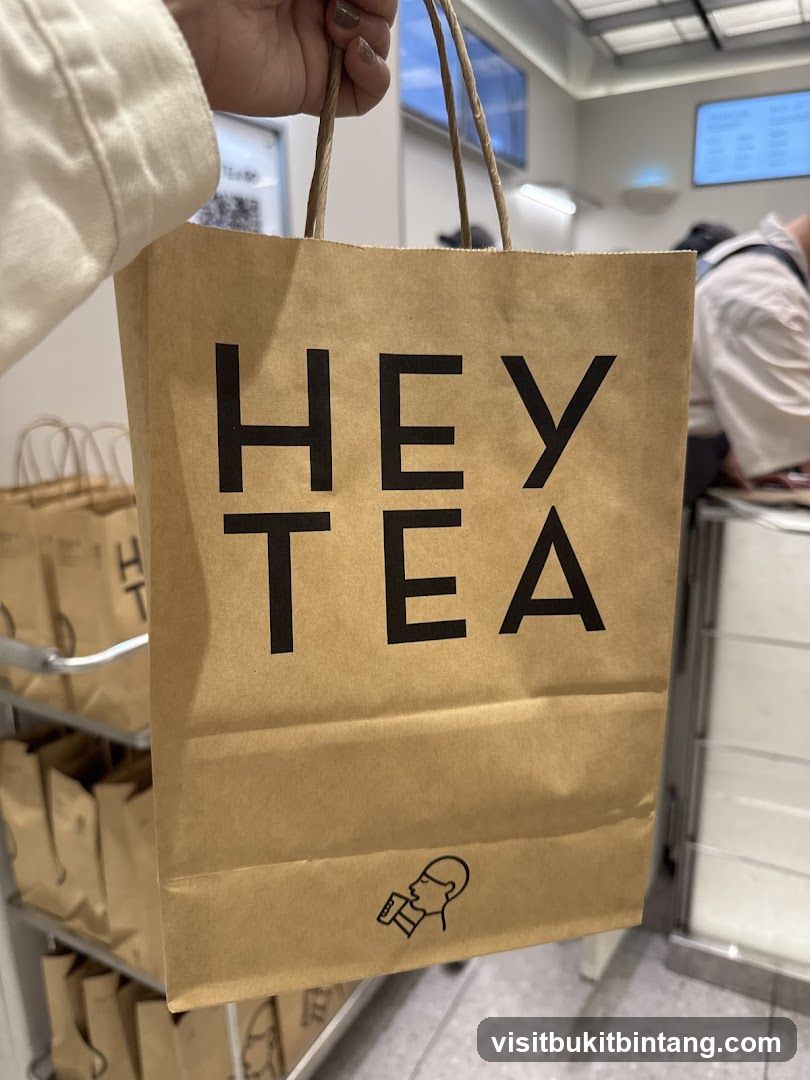 Brown paper bag with "HEY TEA" logo