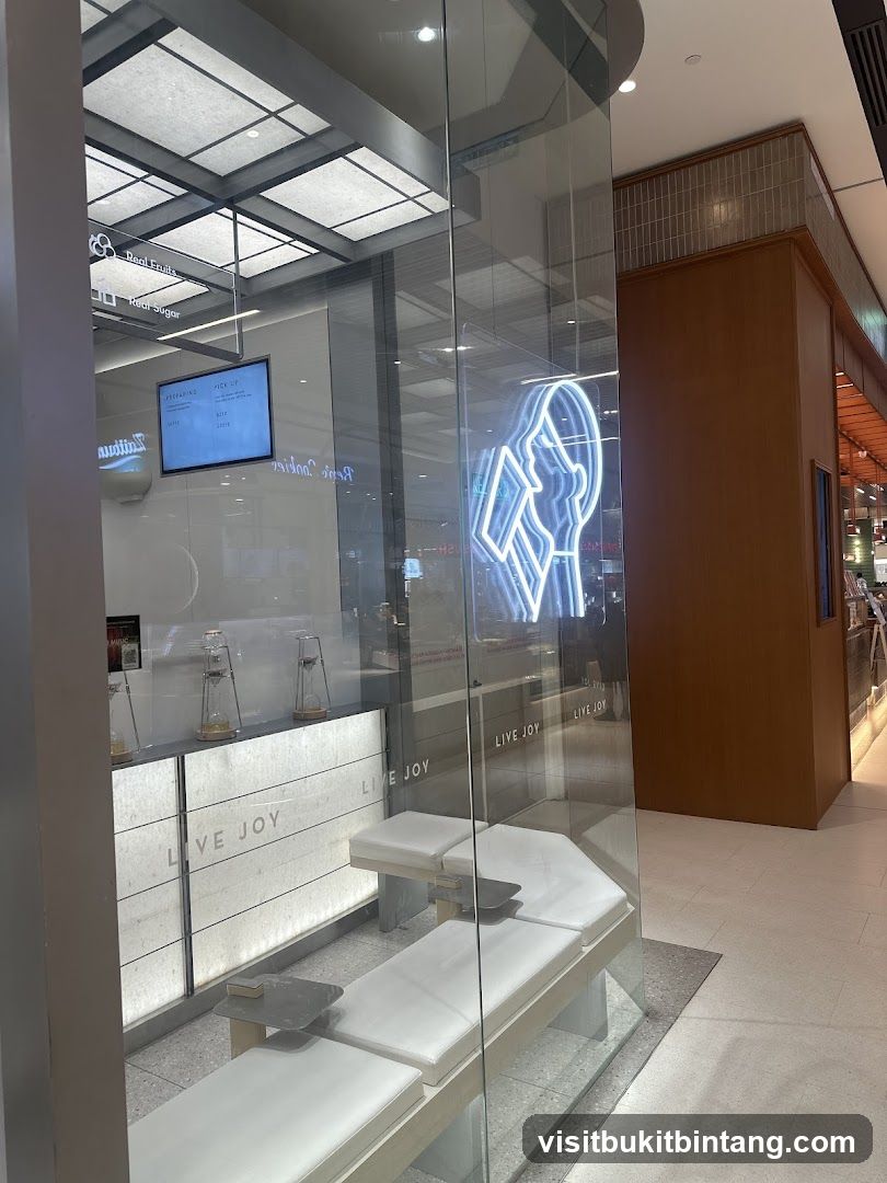 Modern cafe interior with seating and neon sign