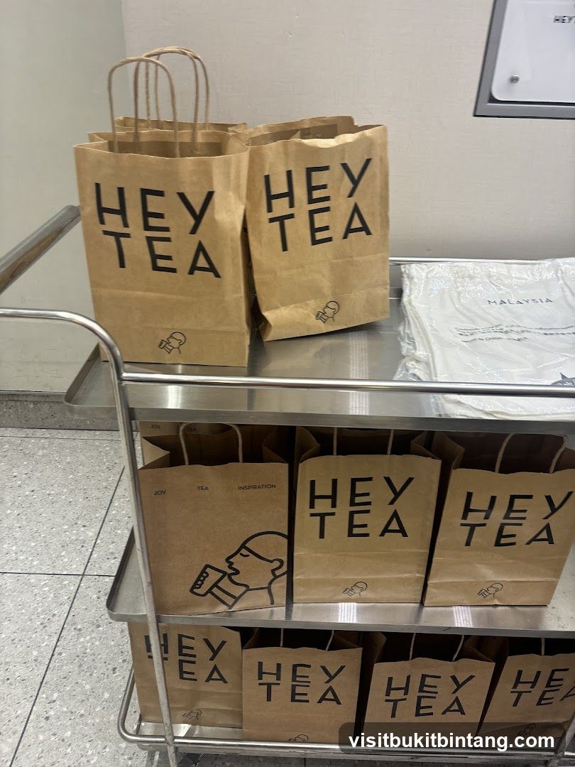 Brown Paper Bags with "Hey Tea" Logo