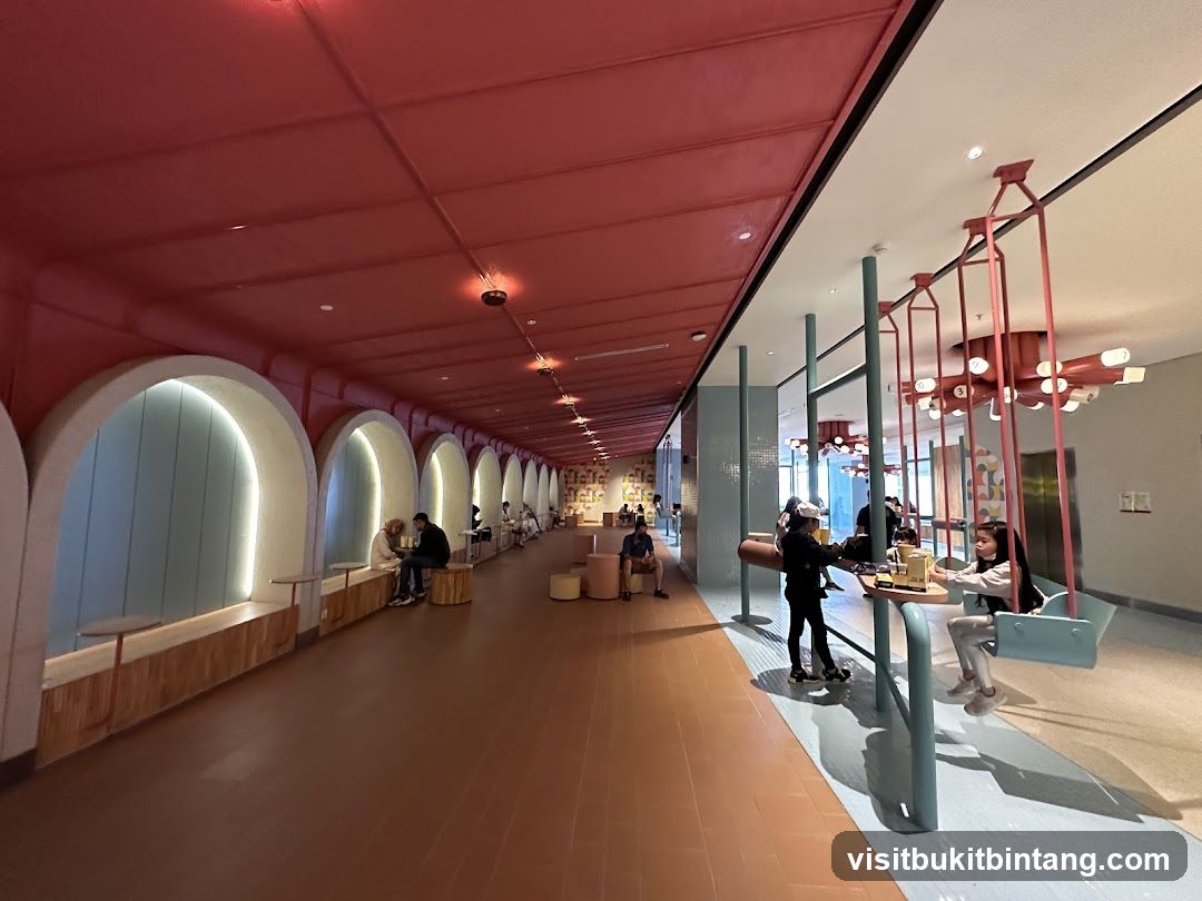 Modern cafe interior with arched seating and swings