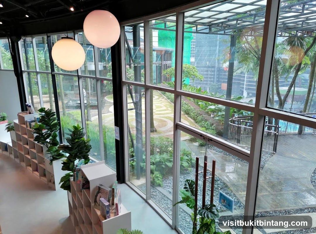 Interior of a modern space with bookshelves and a view of an outdoor garden