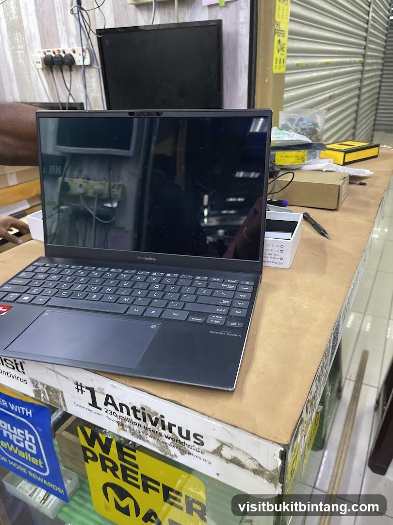 Laptop on a counter with promotional materials