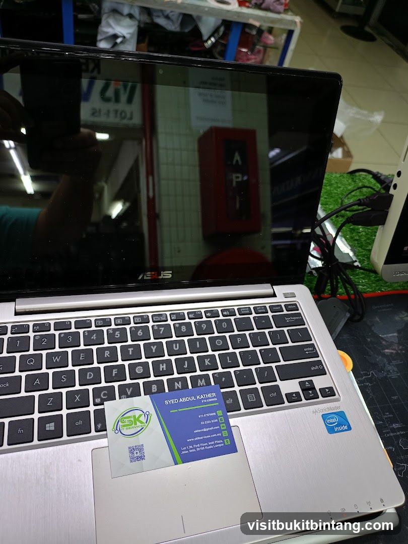 Business card on laptop