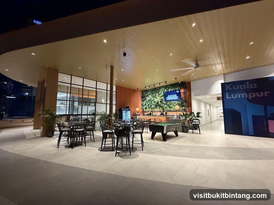 Outdoor seating area with pool table and greenery