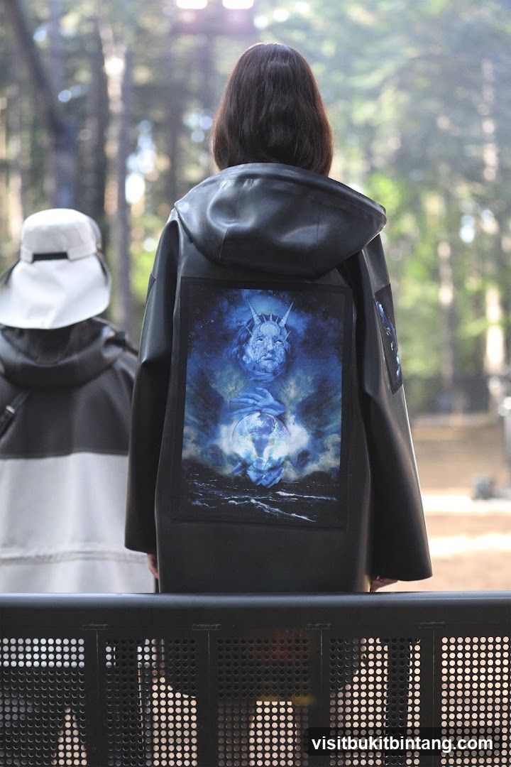 Back of person wearing jacket with graphic
